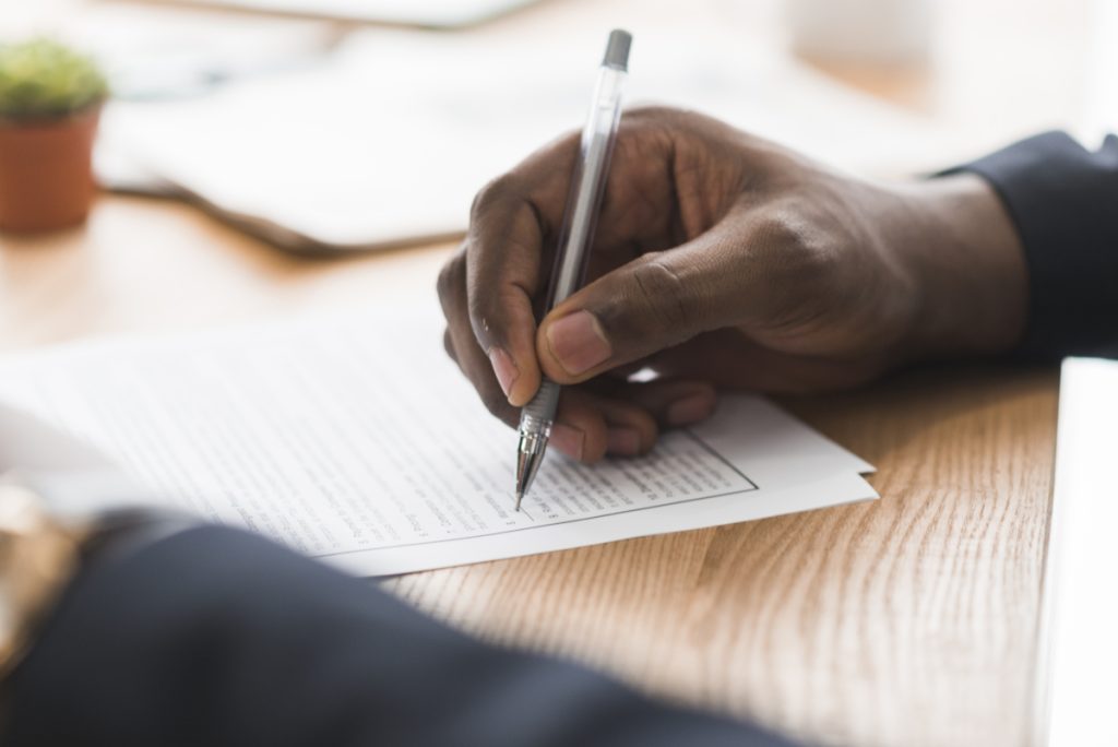 Man signing a document