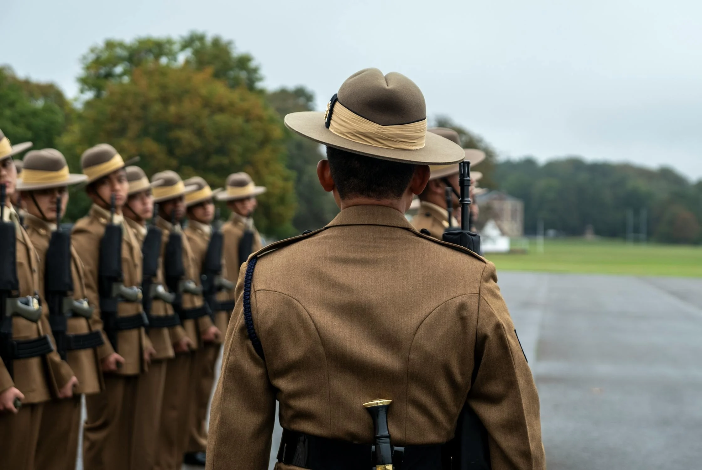 Soldier marching pasts line of soldiers